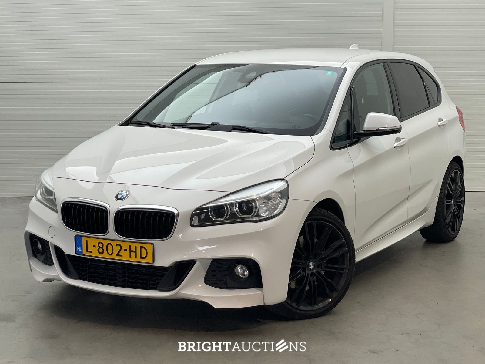 BMW 225i Active Tourer High Executive xDrive 232pk 2015 2-Serie, L-802-HD – kavel bij Bright Auctions, Netherlands