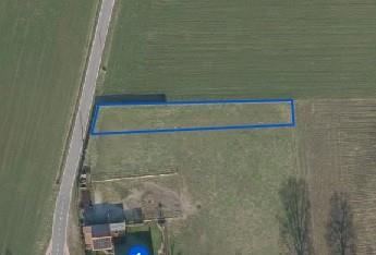 Perceel agrarische grond (7a 28ca), deel uitmakend van een loopweide.