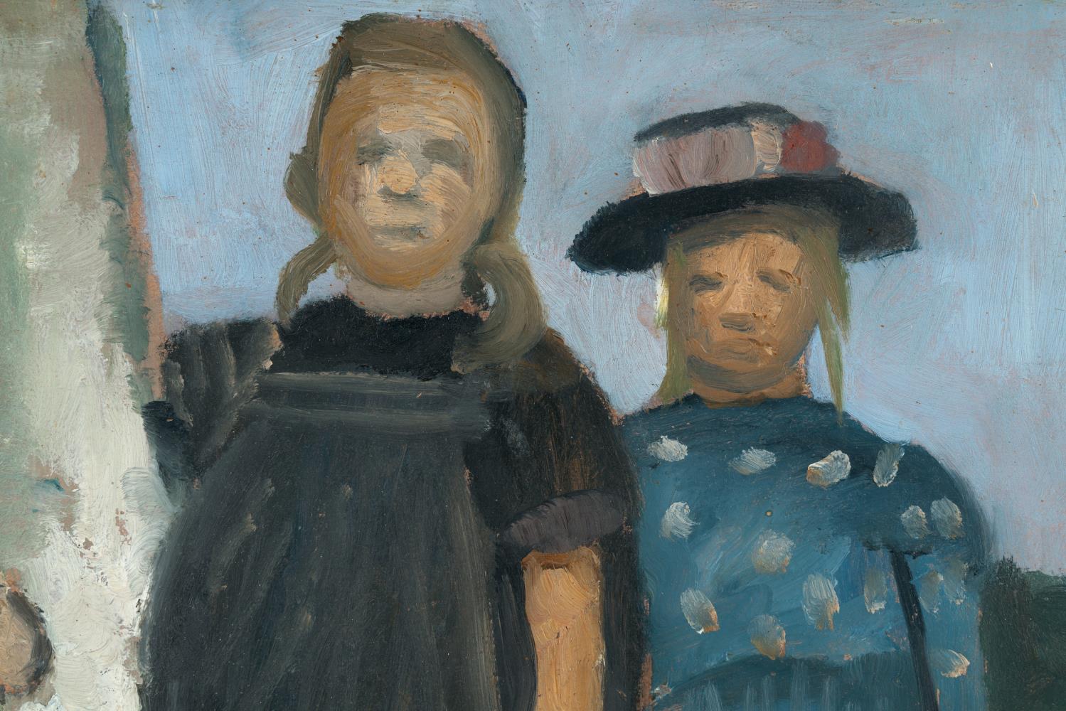 Two girls standing by a birch trunk
