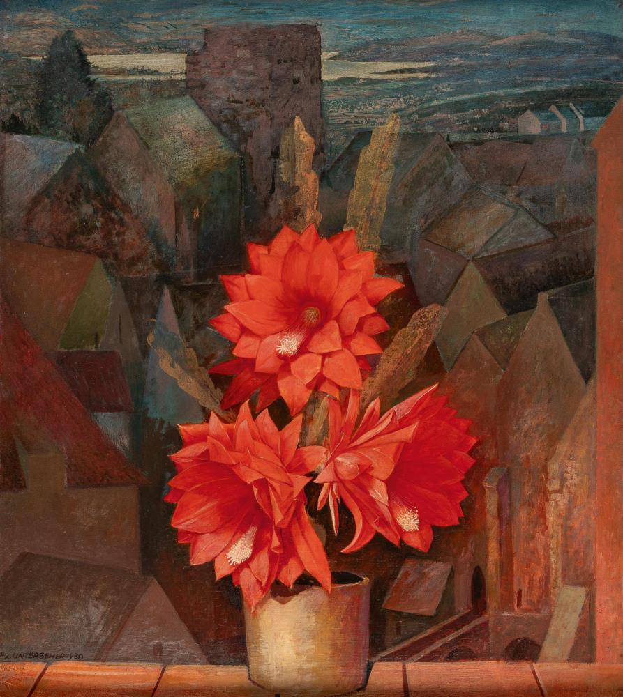 Fensterbrett mit rot blühendem Kaktus vor Dachlandschaft