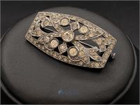 Zilverkleurige broche – kavel bij VH Auctions